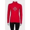 Red sweater with rhinestones on the front