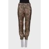 Pants with lurex and print