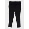 Black trousers with metal belt