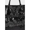 Lacquered black bag with drapery