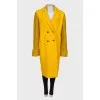 Yellow coat with knitted sleeves