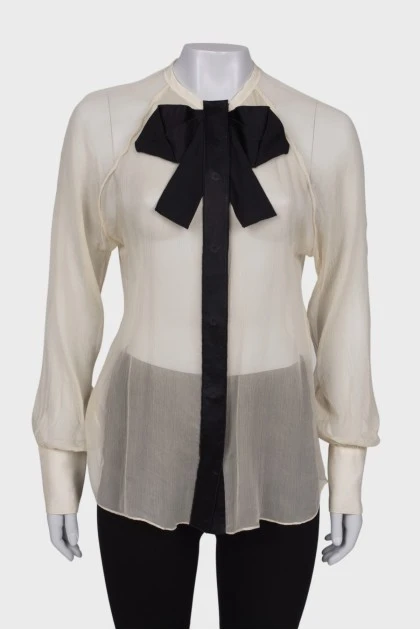 Sheer blouse with a bow