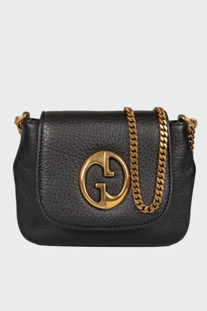 Leather bag with golden chain 1973