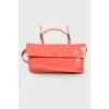 Lacquered pink clutch bag