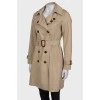 Beige belted trench coat