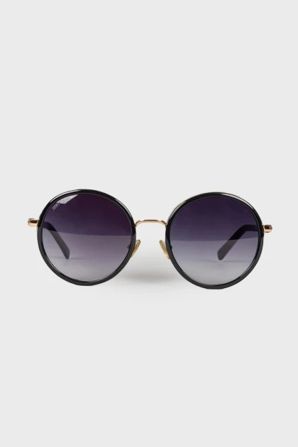 Sunglasses with black and gold frames