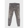Gray jeans with paint stain effect
