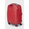 Red suitcase with logo