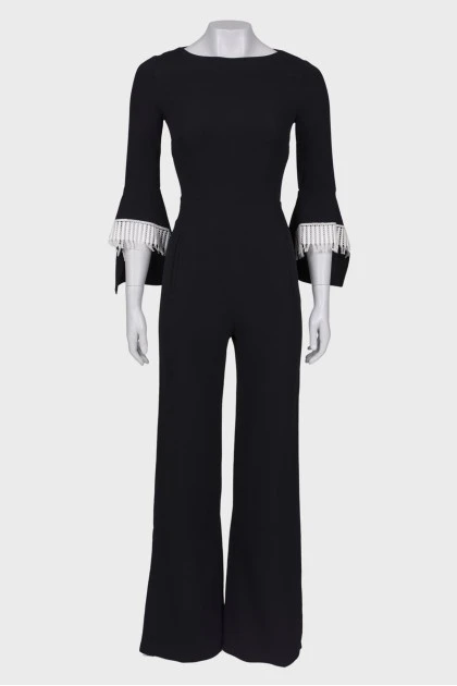 Black jumpsuit close-fitting in the waist