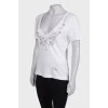 White T-shirt with beaded patch
