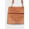 Perforated suede bag