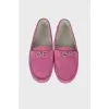 Hot pink moccasins with brand logo