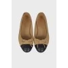 Beige ballerinas with a bow