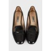Black patent leather ballerina shoes