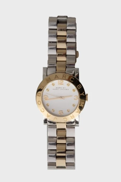Watch with a logo on the bezel
