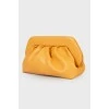 Draped leather clutch