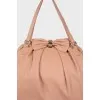 Powder colored leather bag
