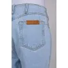Light blue jeans with slits at the waist