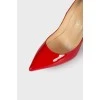Red patent leather pumps