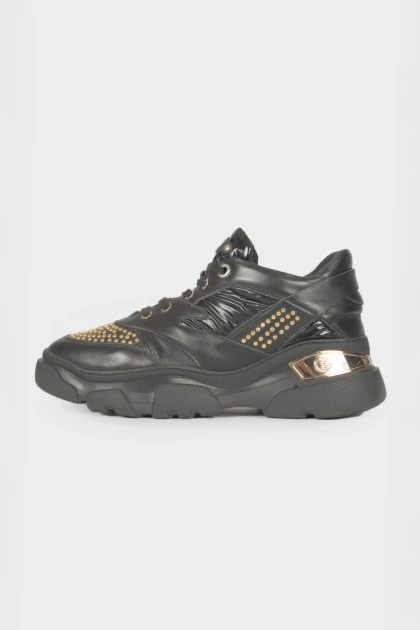 Black sneakers with golden rhinestones