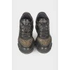 Black sneakers with golden rhinestones
