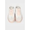 White and pink leather sneakers