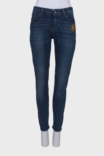 Navy blue jeans with a patch