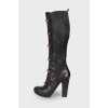 Leather boots with decorative clasp