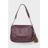 Purple bag with gold hardware