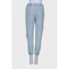 Ripped-effect elasticated jeans