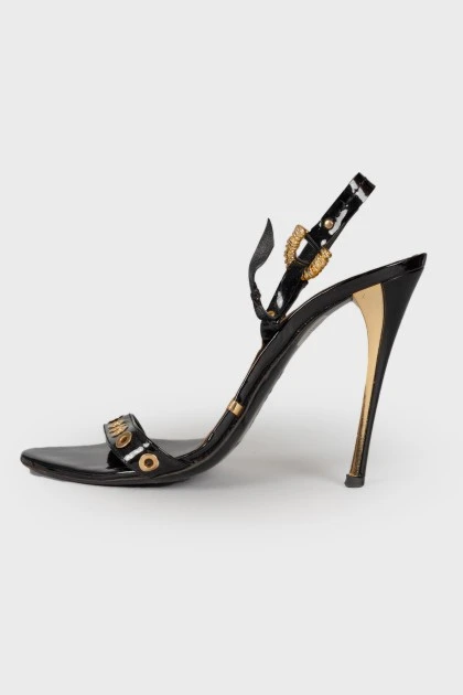 Lacquered sandals with golden hardware