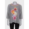 Gray pullover with floral patch