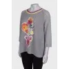 Gray pullover with floral patch