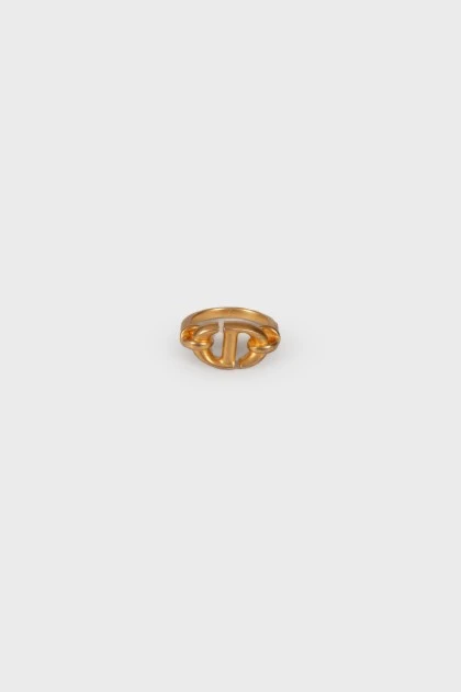 Golden ring with brand logo