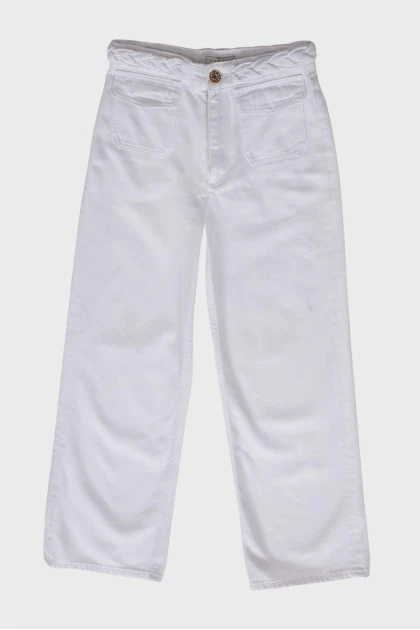 White jeans with a decorative belt
