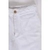 White jeans with a decorative belt