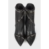 Leather ankle boots decorated with rhinestones