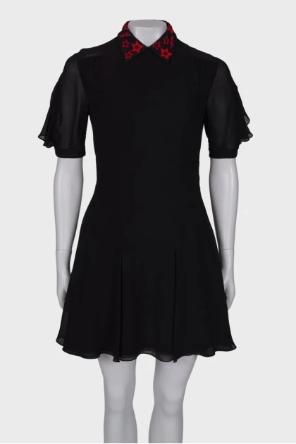 Black dress with embroidery at the collar