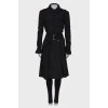 Black double-breasted trench coat with belt