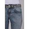 Light blue jeans with embellished belt
