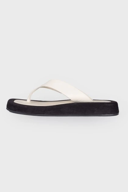 Black and white leather slippers