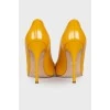 Leather yellow stilettos