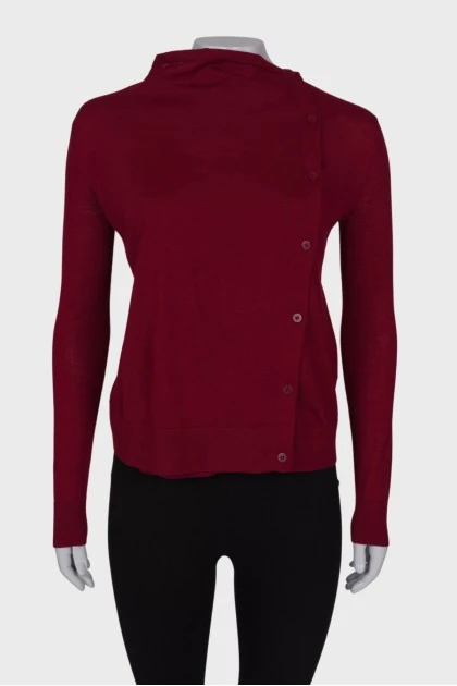 Red sweater with asymmetric fastening