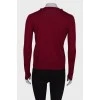 Red sweater with asymmetric fastening