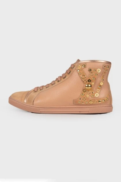 Pink boots with gold hardware