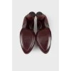 Maroon leather pumps