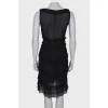 Black dress with a pattern and frills