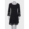 Black dress with lace at the hem