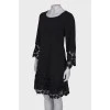 Black dress with lace at the hem