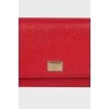 Red embossed clutch